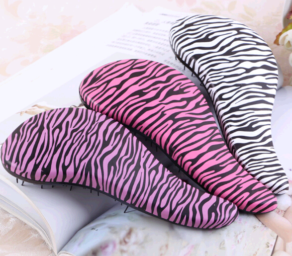 Promotional leopard print paddle shape tt massage comb