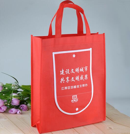 Wholesale orange color folding non woven shopping bag